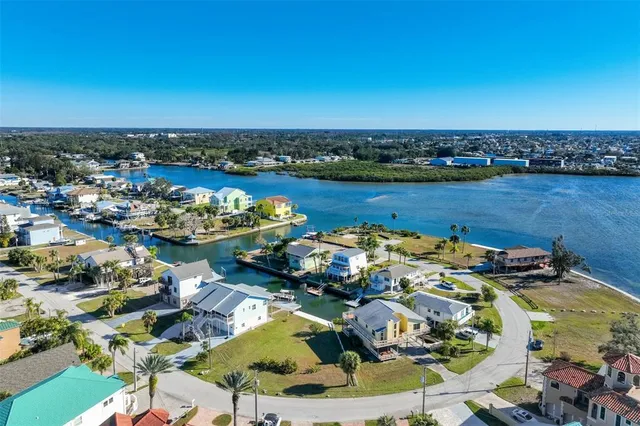a view of a lake with a table and chairs