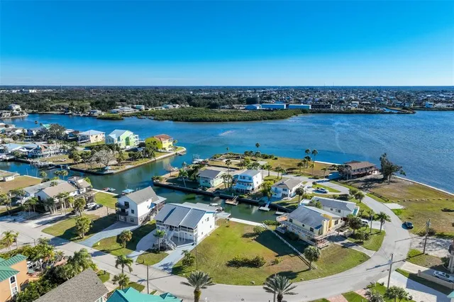 an aerial view of a house with a lake view
