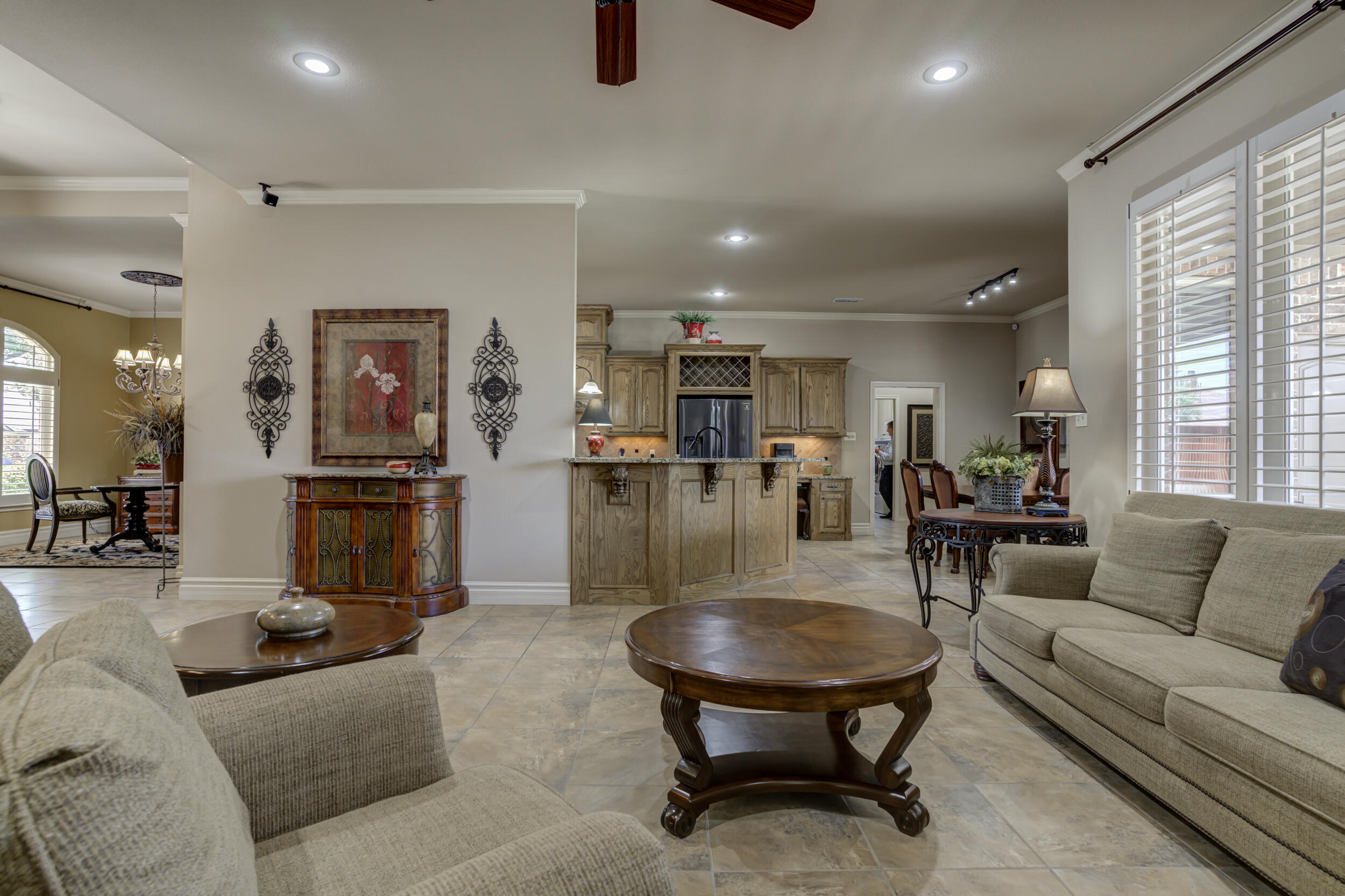 6008 89th Street Lubbock, TX 79424 - Photo 13 of 61 a living room with furniture and kitchen view