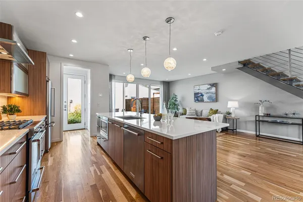 a kitchen with stainless steel appliances a stove sink and cabinets