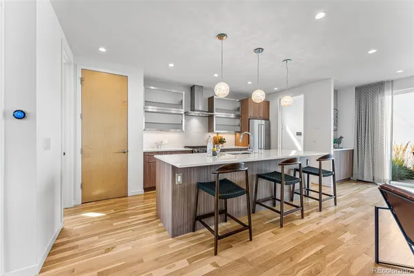 a kitchen with a table and chairs in it