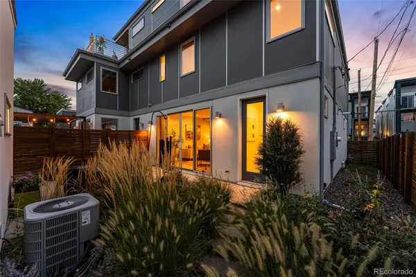 a dining room with furniture and front door