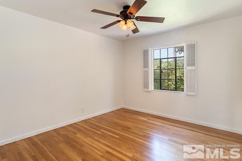 577-575 West Taylor Street Reno, NV 89509 - Photo 13 of 25 an empty room with a window and a fan