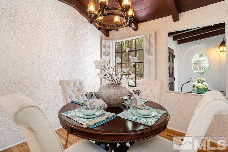 577-575 West Taylor Street Reno, NV 89509 - Photo 8 of 25 a view of a dining room with furniture and chandelier