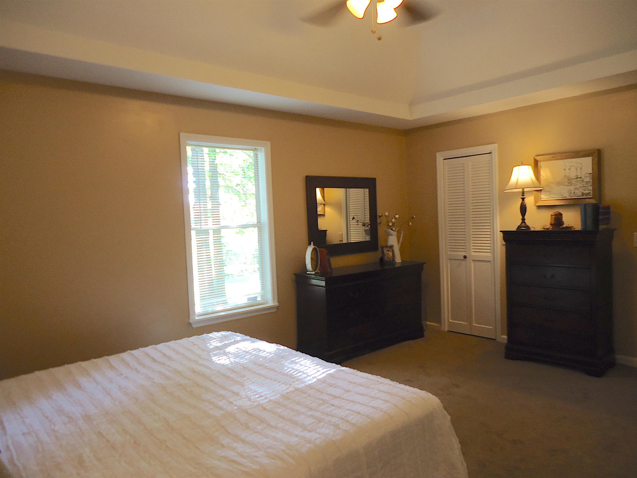4481 Washington Road Greenbrier, TN 37073 - Photo 15 of 30 a bedroom with a bed and wooden floor