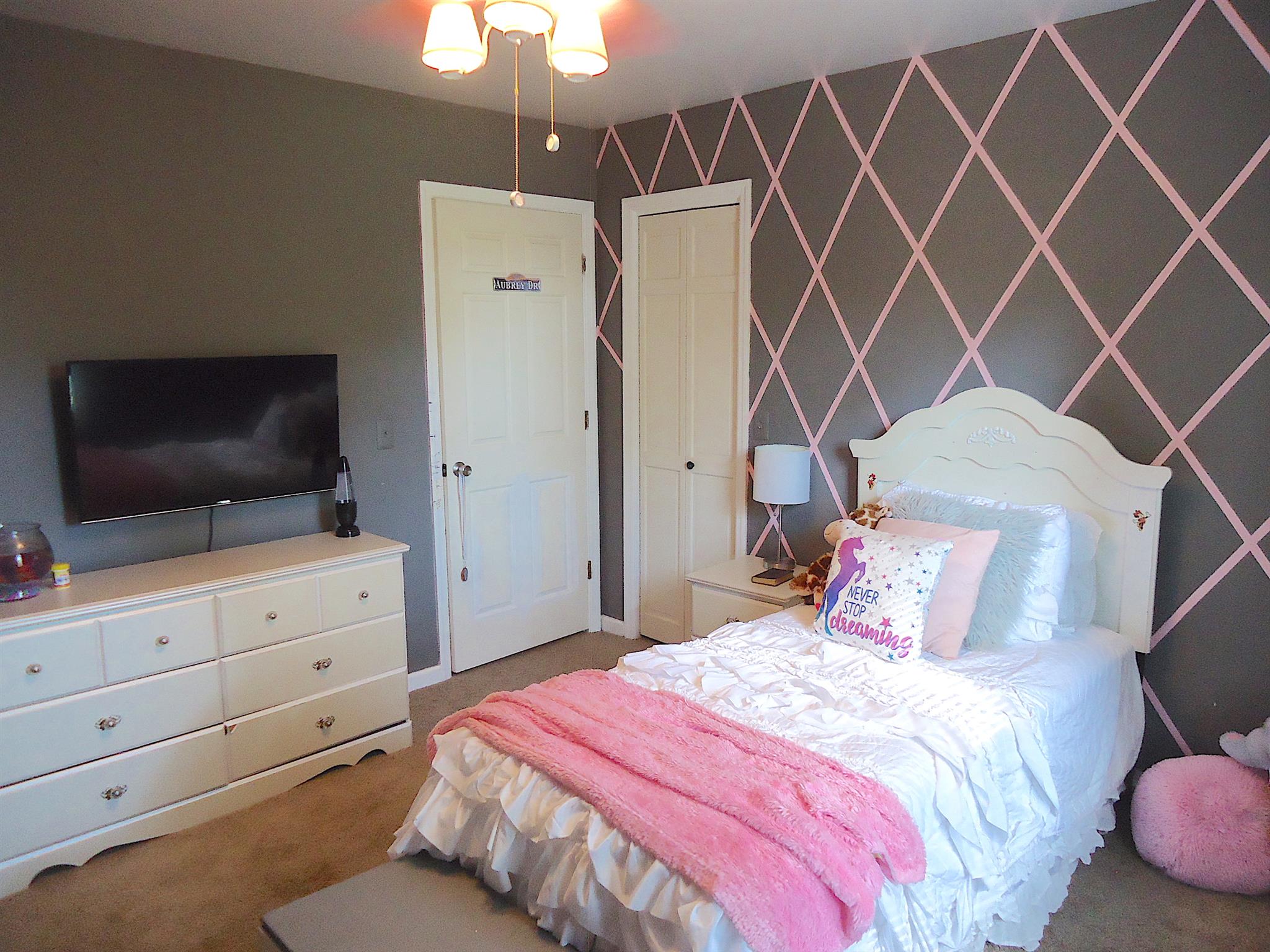 4481 Washington Road Greenbrier, TN 37073 - Photo 18 of 30 a bedroom with a bed and a flat screen tv