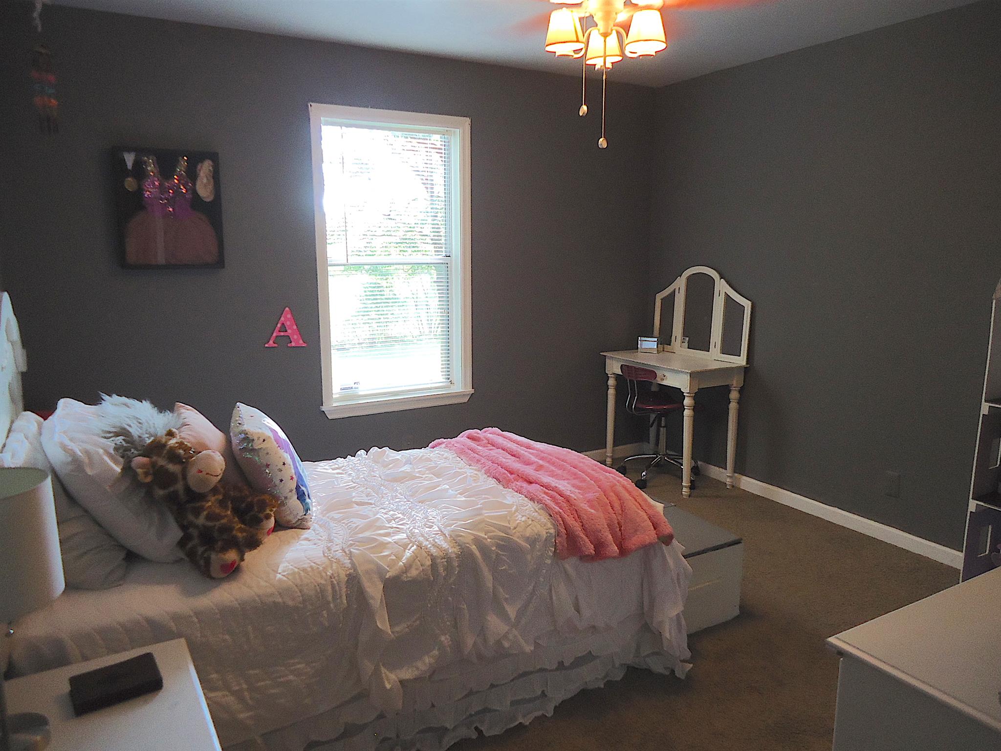 4481 Washington Road Greenbrier, TN 37073 - Photo 19 of 30 a bed sitting in a bedroom next to a window