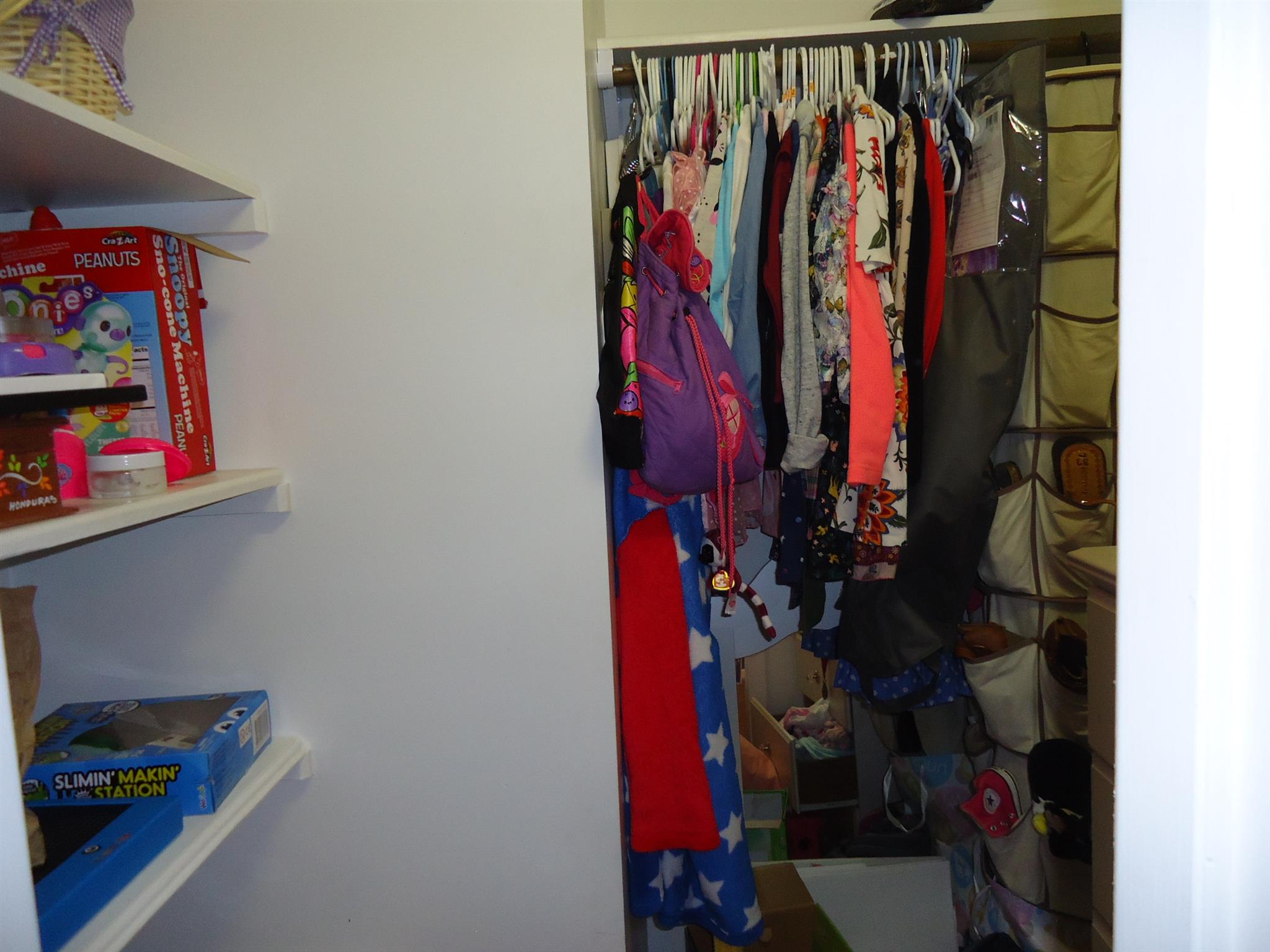 4481 Washington Road Greenbrier, TN 37073 - Photo 20 of 30 a view of walk in closet with clothes and shoes