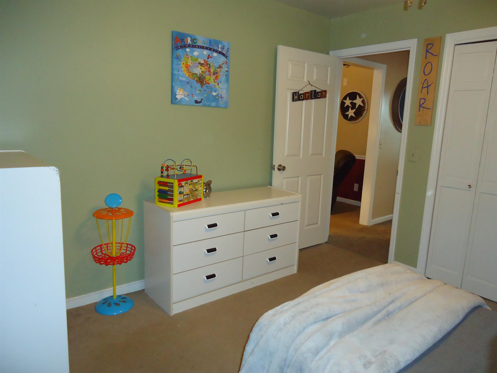 4481 Washington Road Greenbrier, TN 37073 - Photo 24 of 30 a bedroom with a bed and a dresser