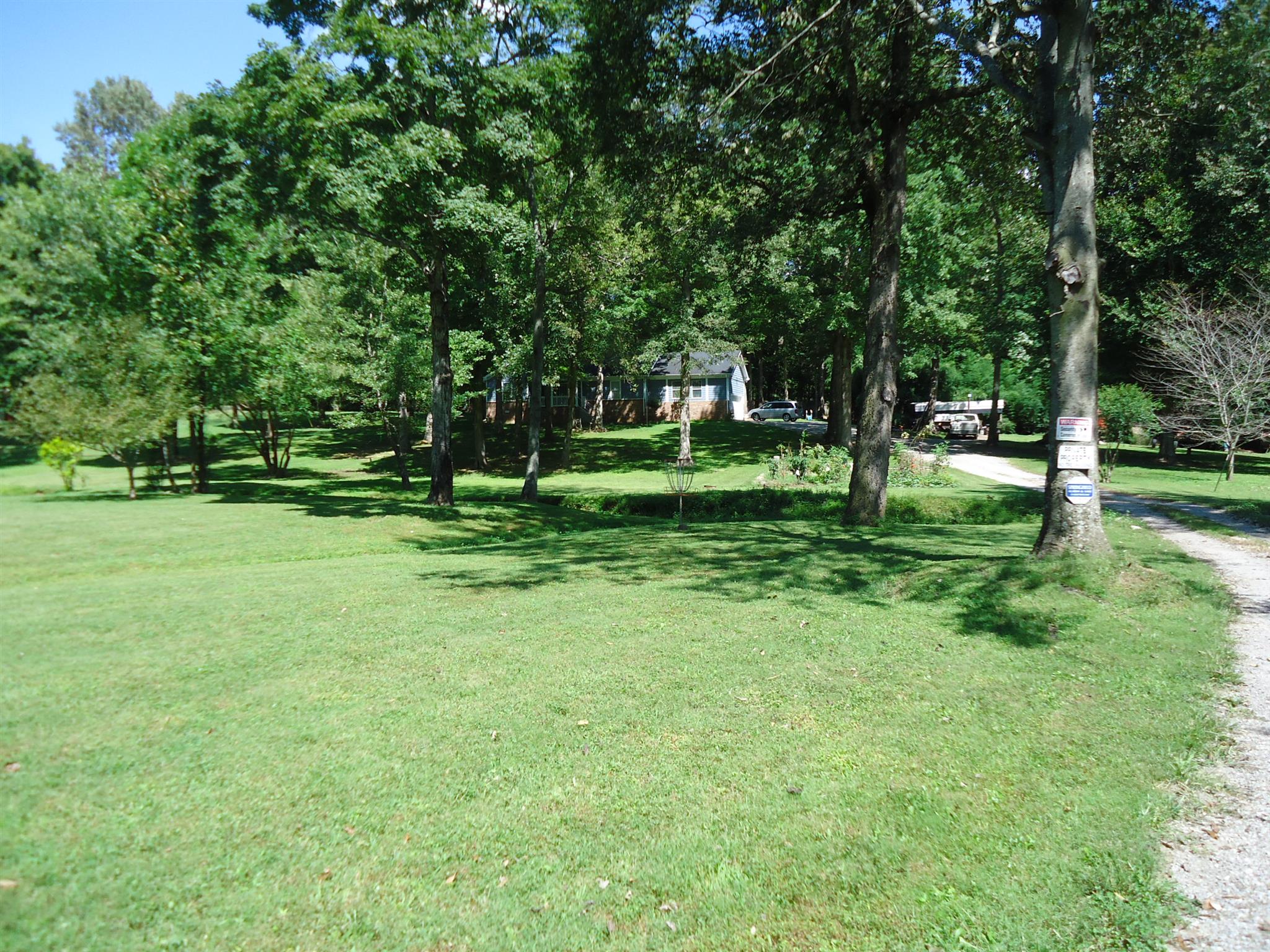 4481 Washington Road Greenbrier, TN 37073 - Photo 2 of 30 a view of a park with trees in the background