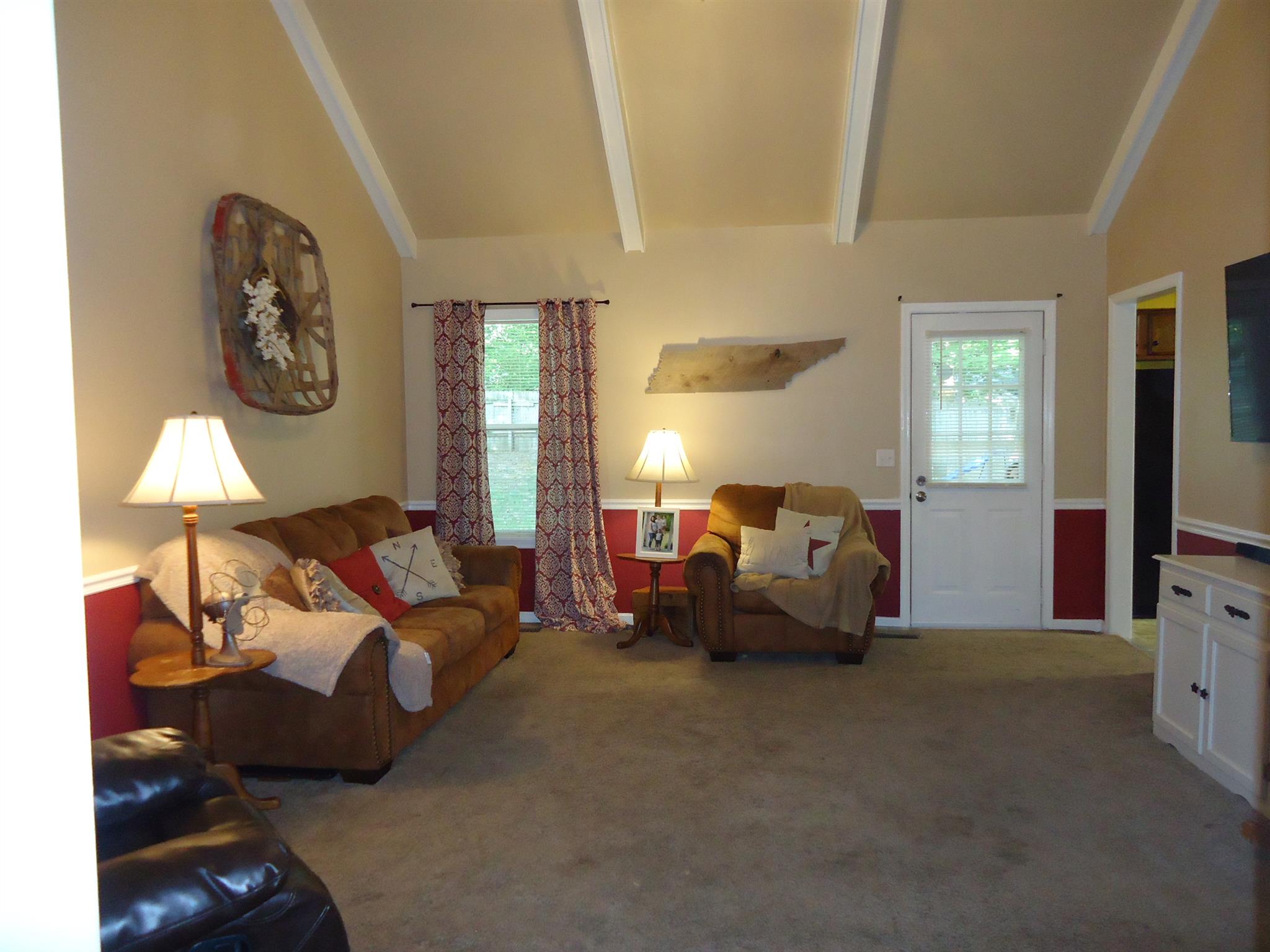 4481 Washington Road Greenbrier, TN 37073 - Photo 4 of 30 a bed room with furniture and a flat screen tv