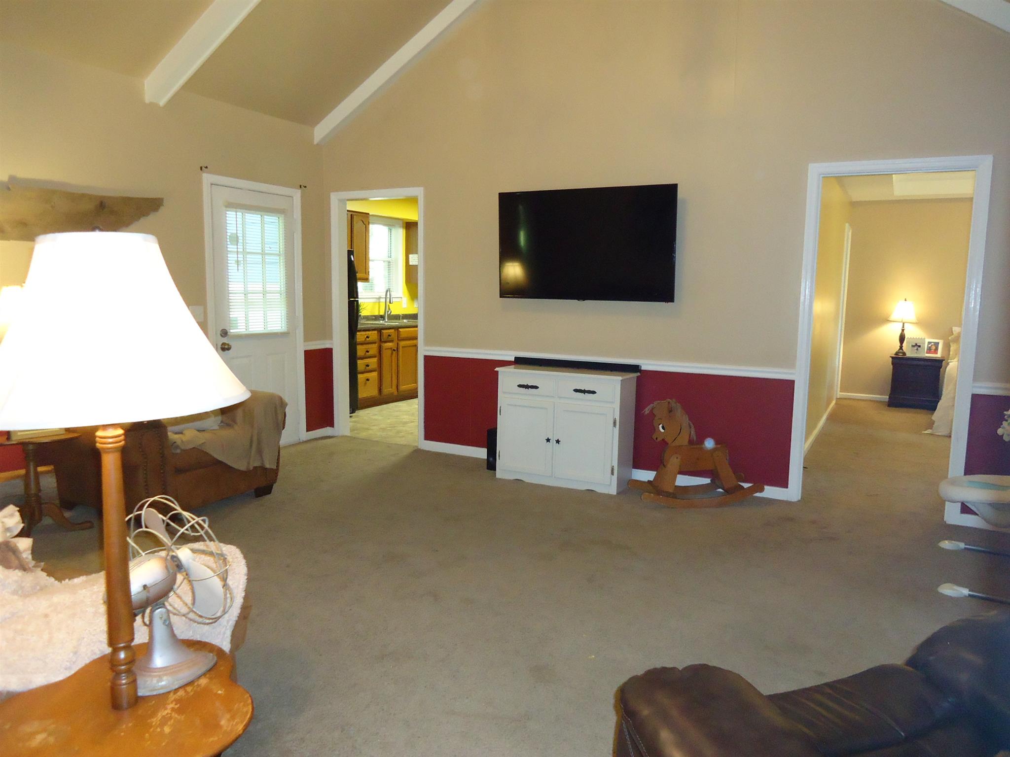 4481 Washington Road Greenbrier, TN 37073 - Photo 6 of 30 a living room with furniture and a flat screen tv
