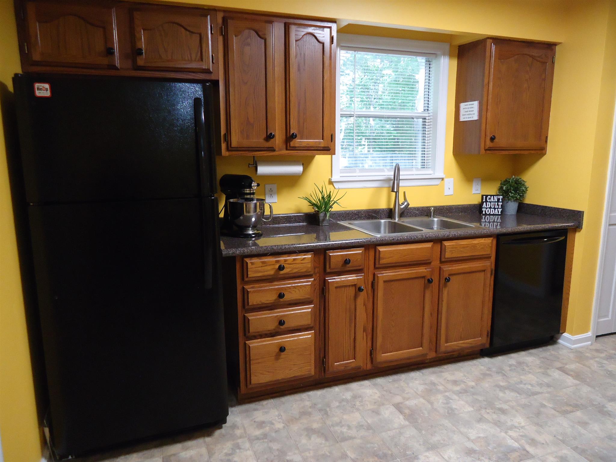 4481 Washington Road Greenbrier, TN 37073 - Photo 7 of 30 a kitchen with a refrigerator and a sink