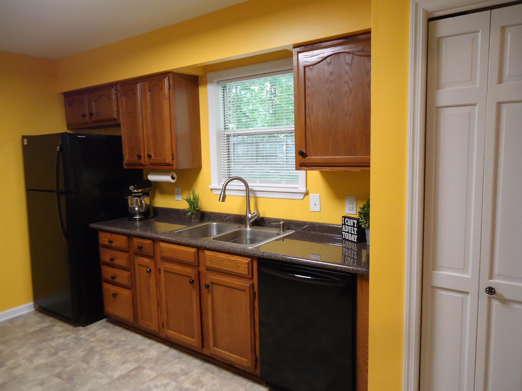 4481 Washington Road Greenbrier, TN 37073 - Photo 9 of 30 a kitchen with a sink and a refrigerator