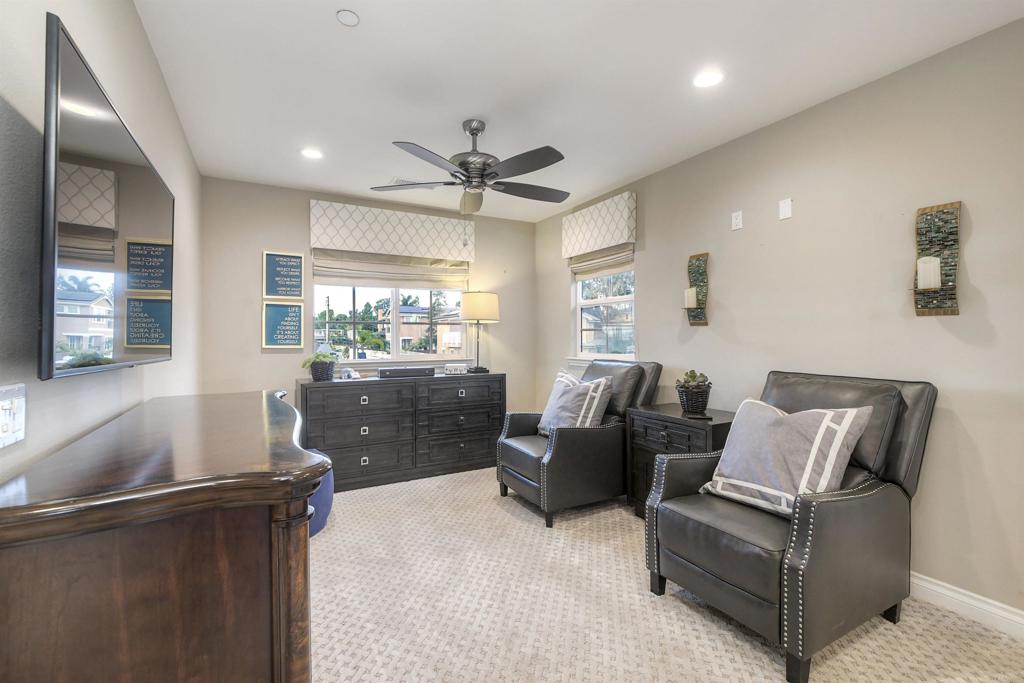 917 Santo Way Cardiff-by-the-Sea, CA 92007 - Photo 21 of 43 a living room with furniture and a large window