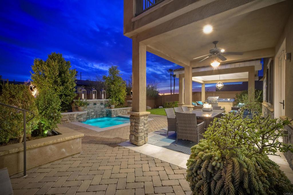 917 Santo Way Cardiff-by-the-Sea, CA 92007 - Photo 29 of 43 a room with lots of potted plants and a chairs