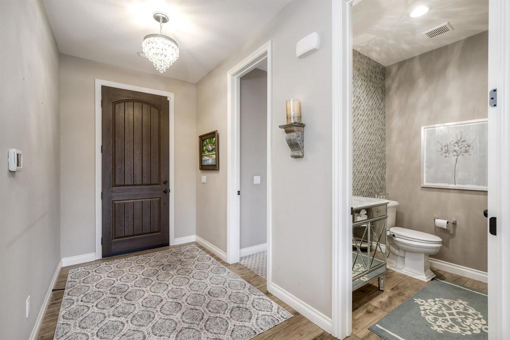 917 Santo Way Cardiff-by-the-Sea, CA 92007 - Photo 3 of 43 a bathroom with a toilet sink and shower