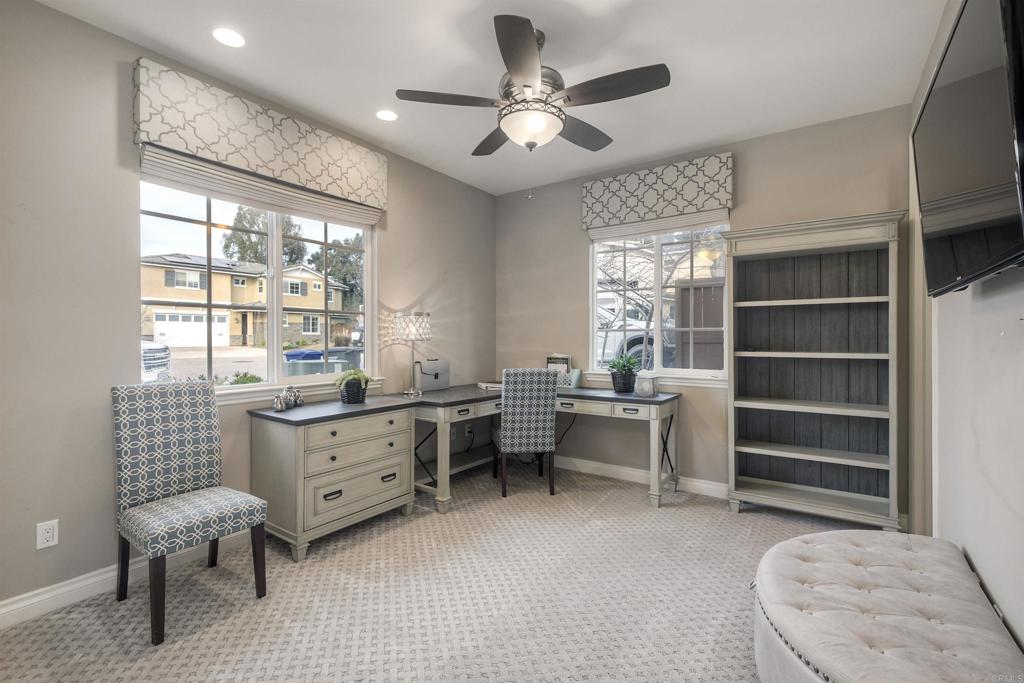 917 Santo Way Cardiff-by-the-Sea, CA 92007 - Photo 5 of 43 a room with gym equipment and a window