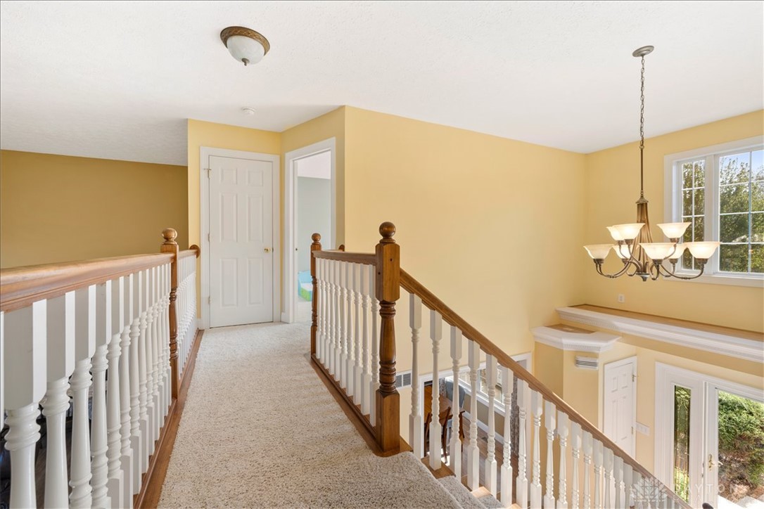 841 Willow Road Springfield, OH 45502 - Photo 30 of 64 This brightly lit landing features a stylish chandelier and ample natural light.
