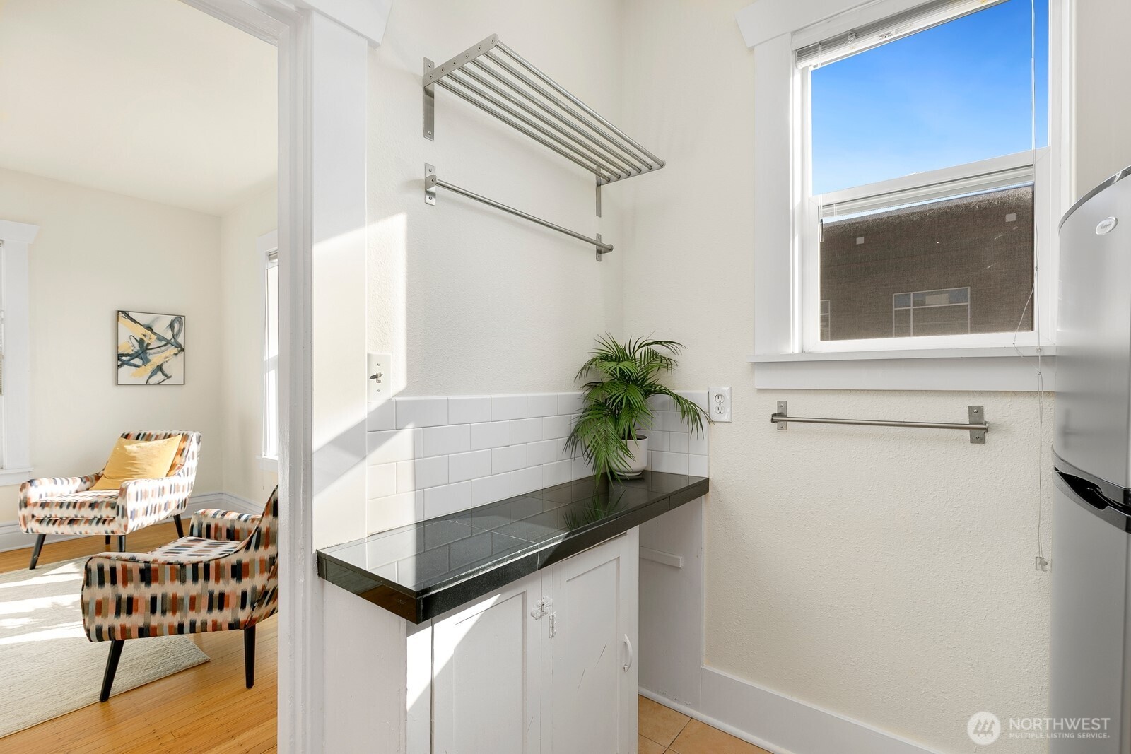 901 Northeast 43rd Street, Unit 306 Seattle, WA 98105 - Photo 11 of 23 a living room with furniture and a window