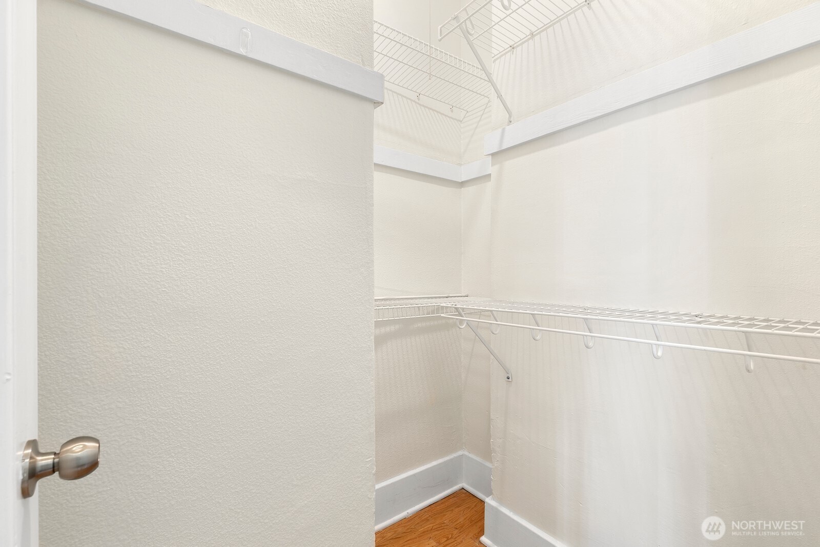 901 Northeast 43rd Street, Unit 306 Seattle, WA 98105 - Photo 16 of 23 a view of a room with racks on the wall