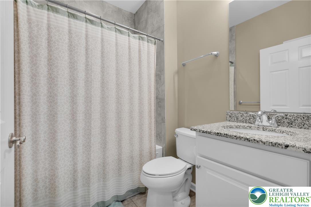 1011 Resolution Drive Bethlehem, PA 18017 - Photo 31 of 49 a bathroom with a granite countertop toilet and a sink