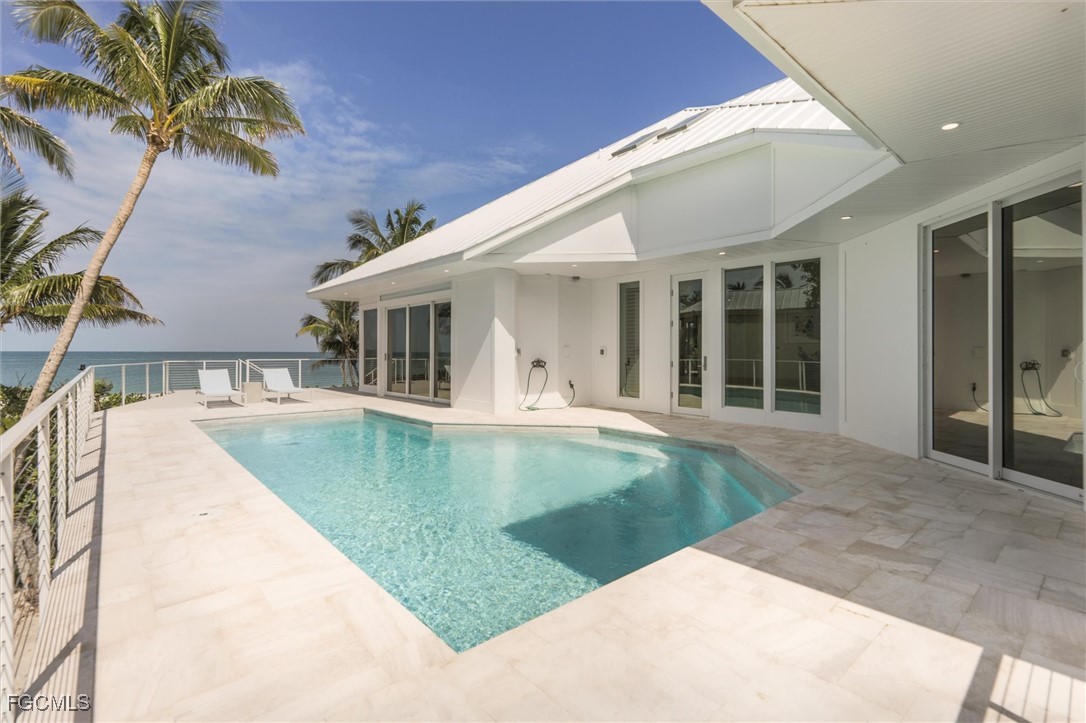 941 South Seas Plantation Road Captiva, FL 33924 - Photo 36 of 50 a view of a house with pool and chairs