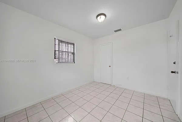 a view of an empty room and window