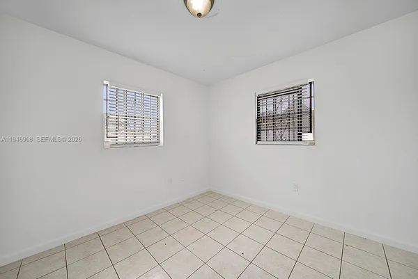a view of an empty room with windows