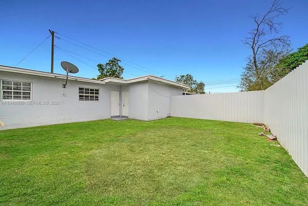 a view of a backyard with plants
