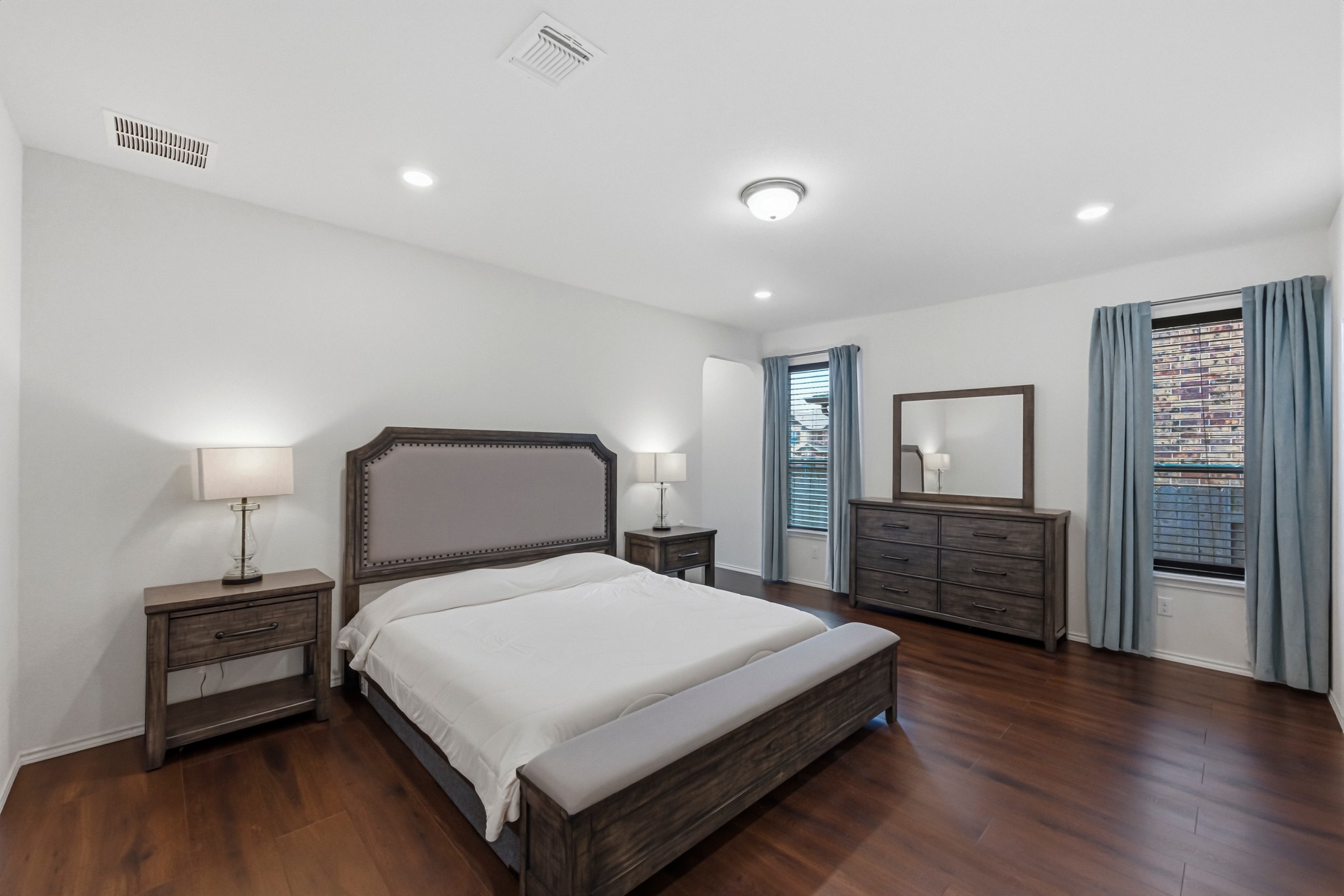 1236 Cornith Lane Leander, TX 78641 - Photo 17 of 32 a bedroom with a bed and wooden floor