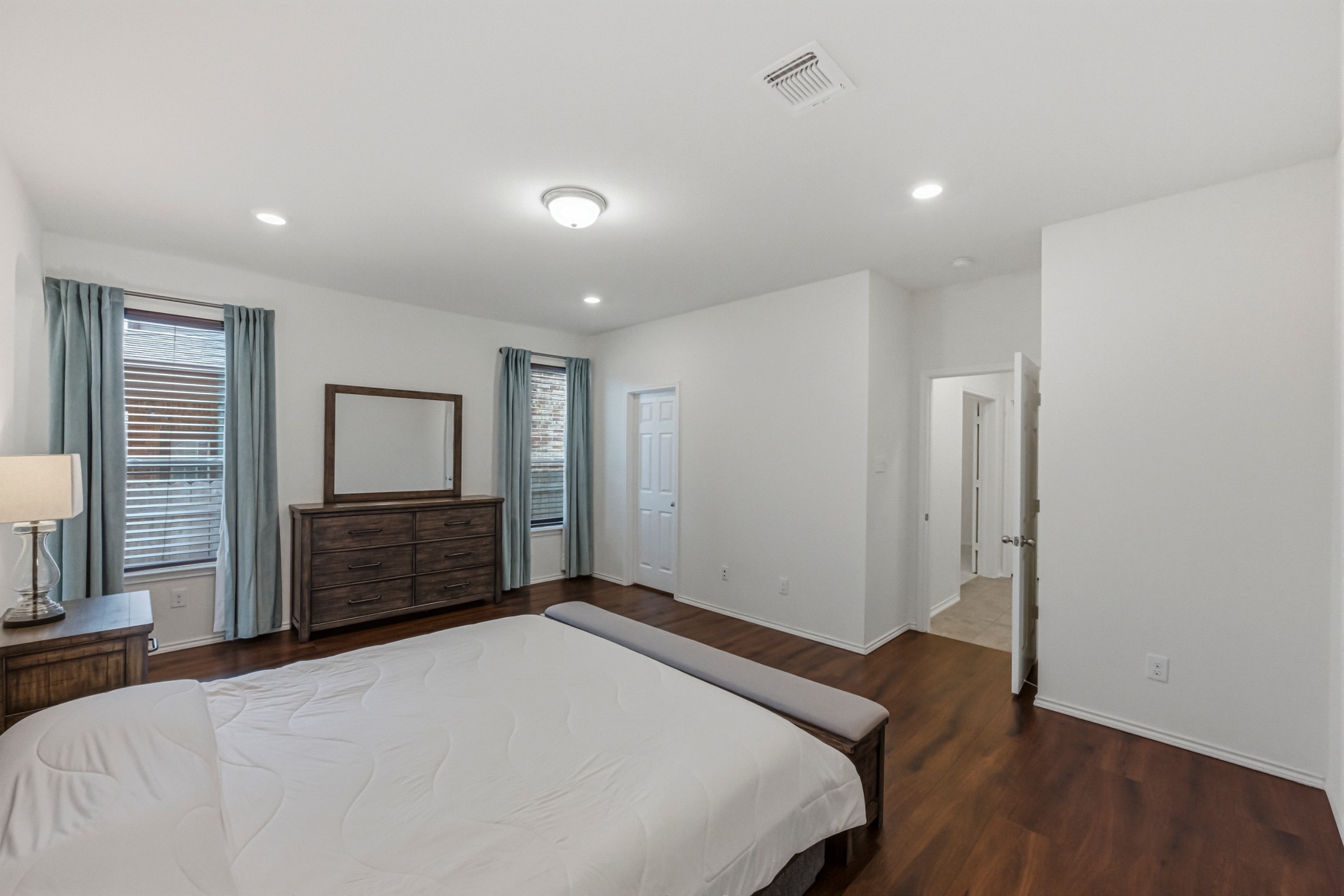 1236 Cornith Lane Leander, TX 78641 - Photo 18 of 32 a bedroom with a bed and a dresser