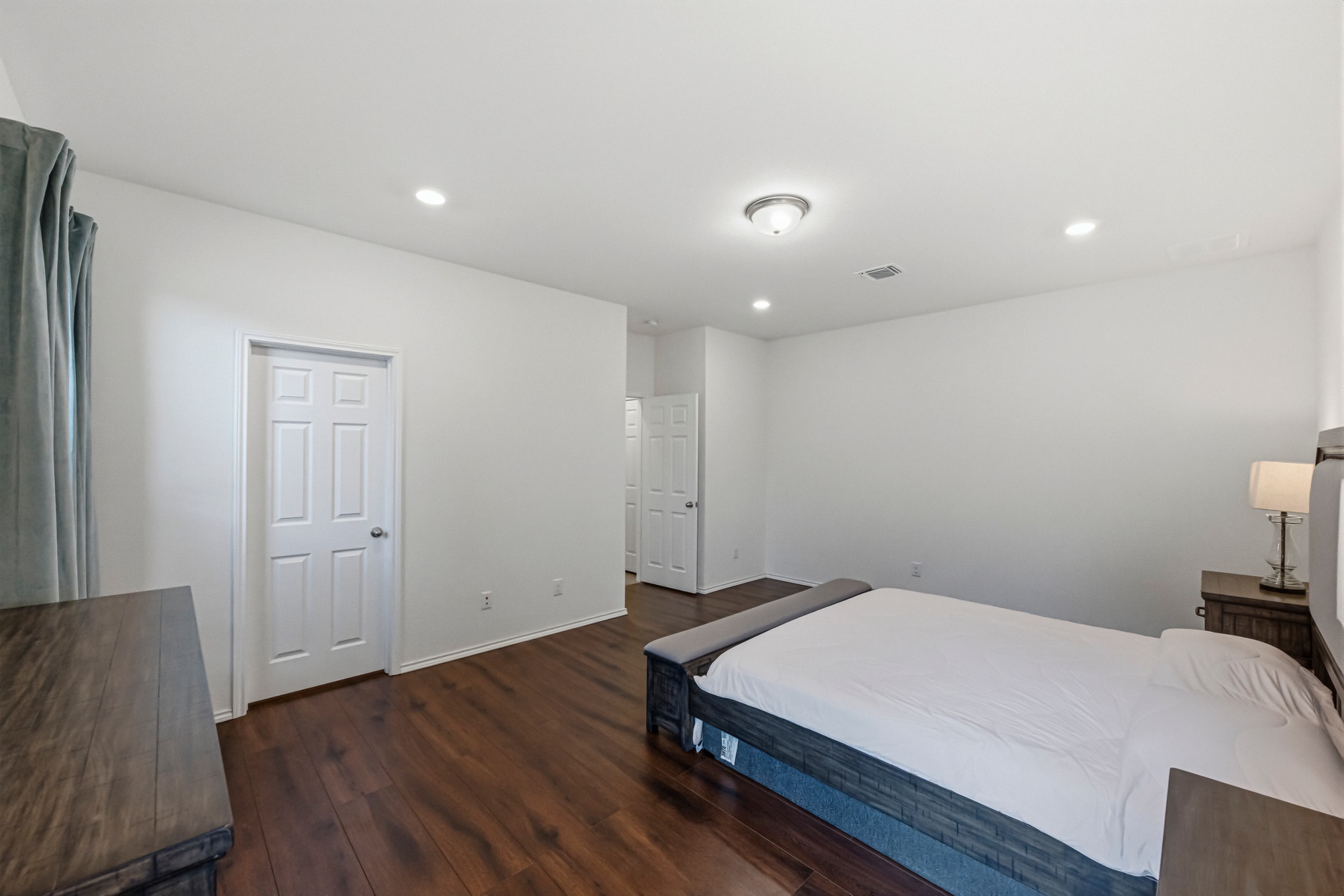 1236 Cornith Lane Leander, TX 78641 - Photo 19 of 32 a bedroom with a bed and a table in it
