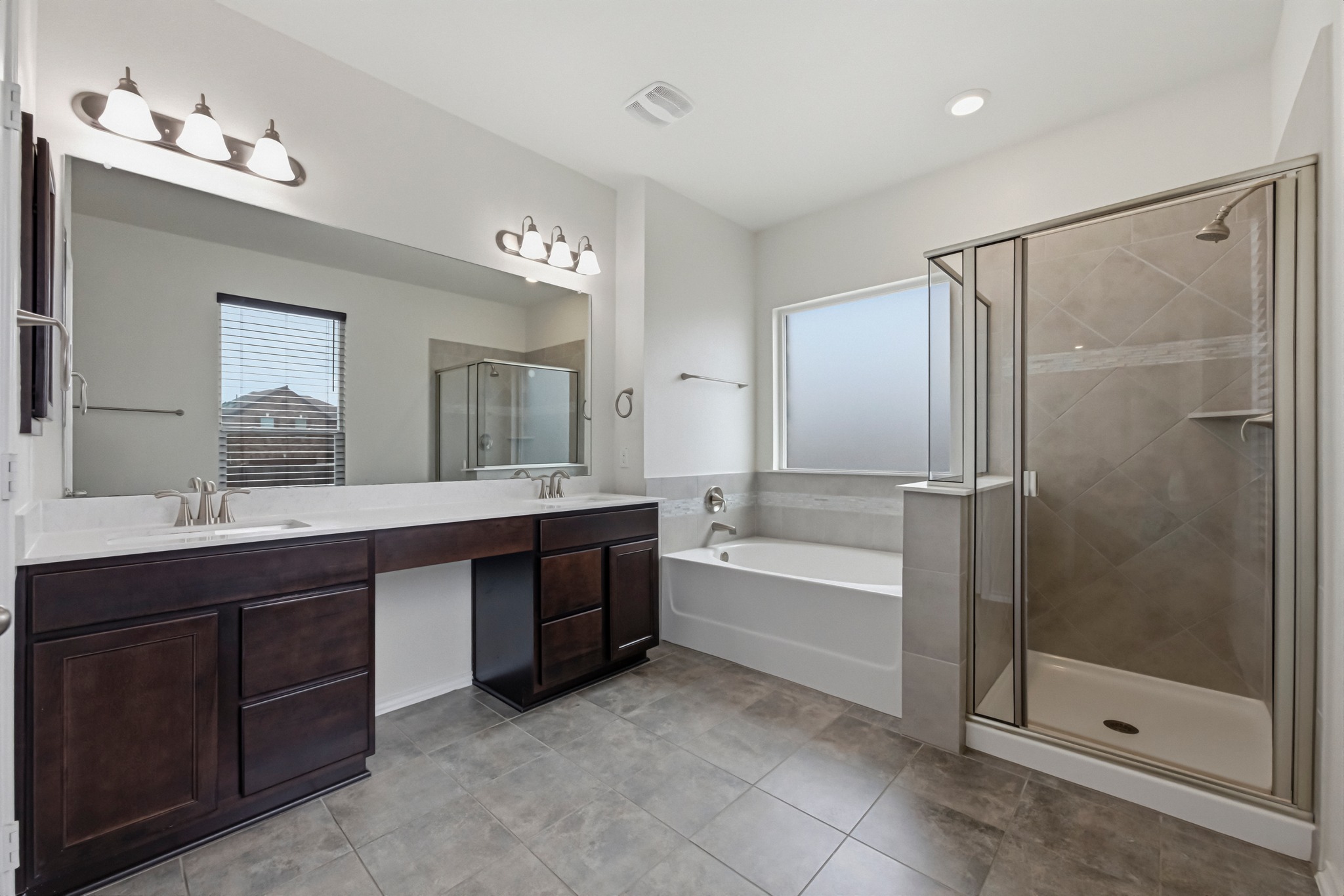 1236 Cornith Lane Leander, TX 78641 - Photo 20 of 32 a bathroom with a bathtub shower sink and mirror