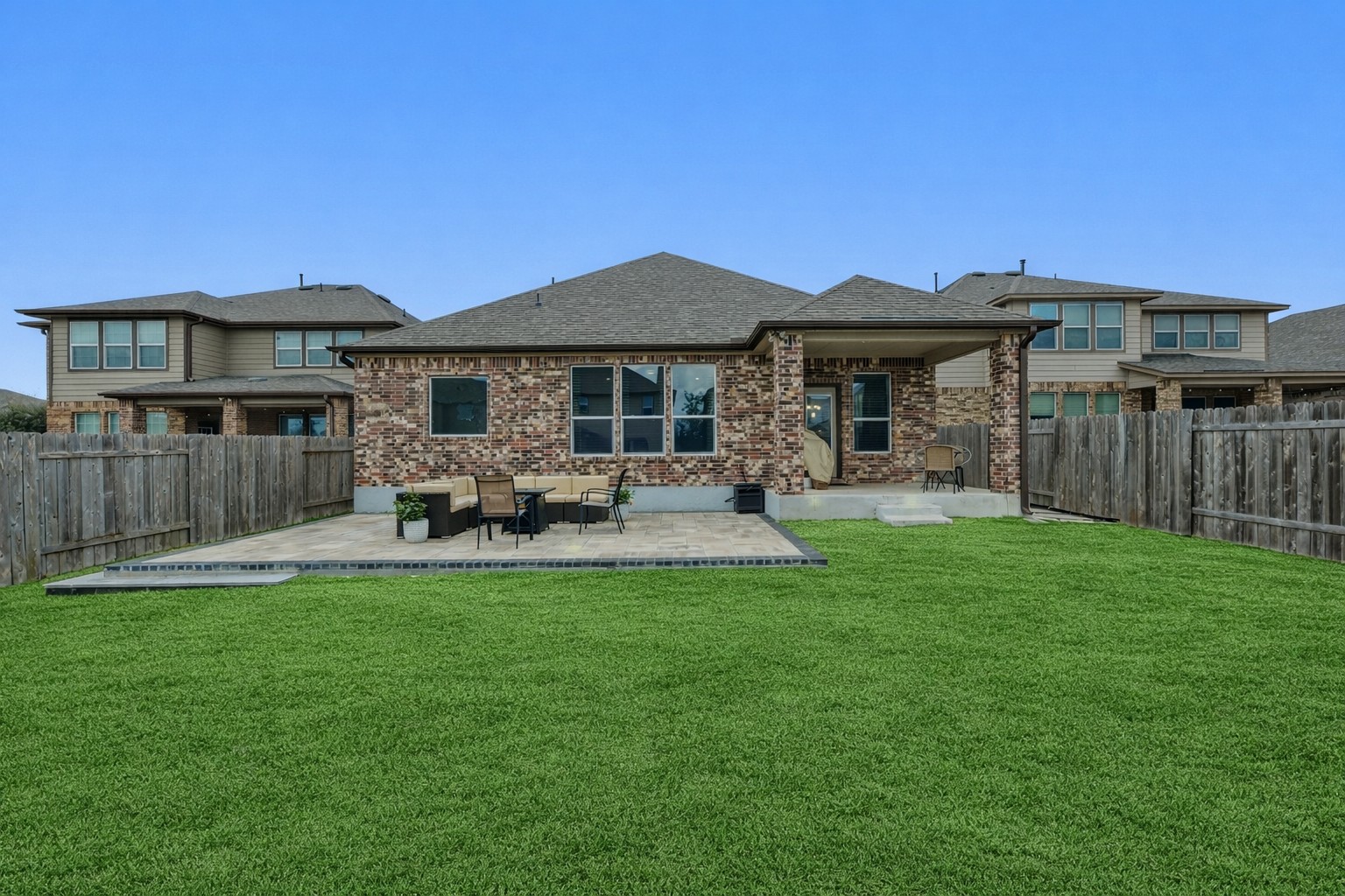 1236 Cornith Lane Leander, TX 78641 - Photo 28 of 32 a view of a house with a backyard and a patio