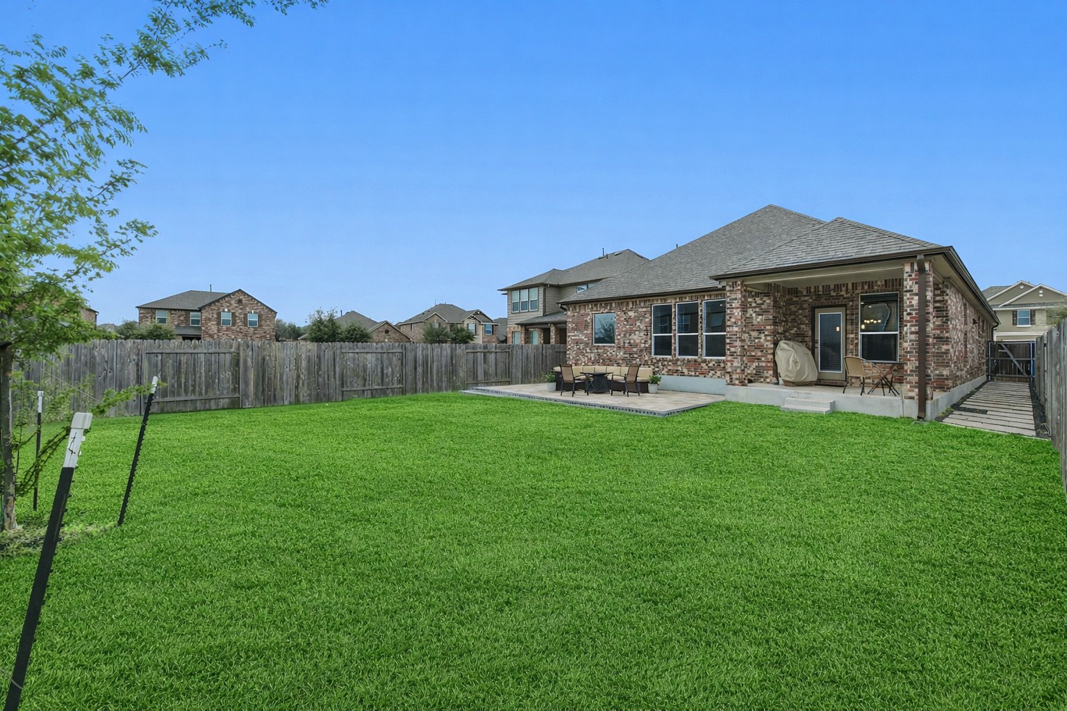 1236 Cornith Lane Leander, TX 78641 - Photo 31 of 32 a view of a house with backyard and porch