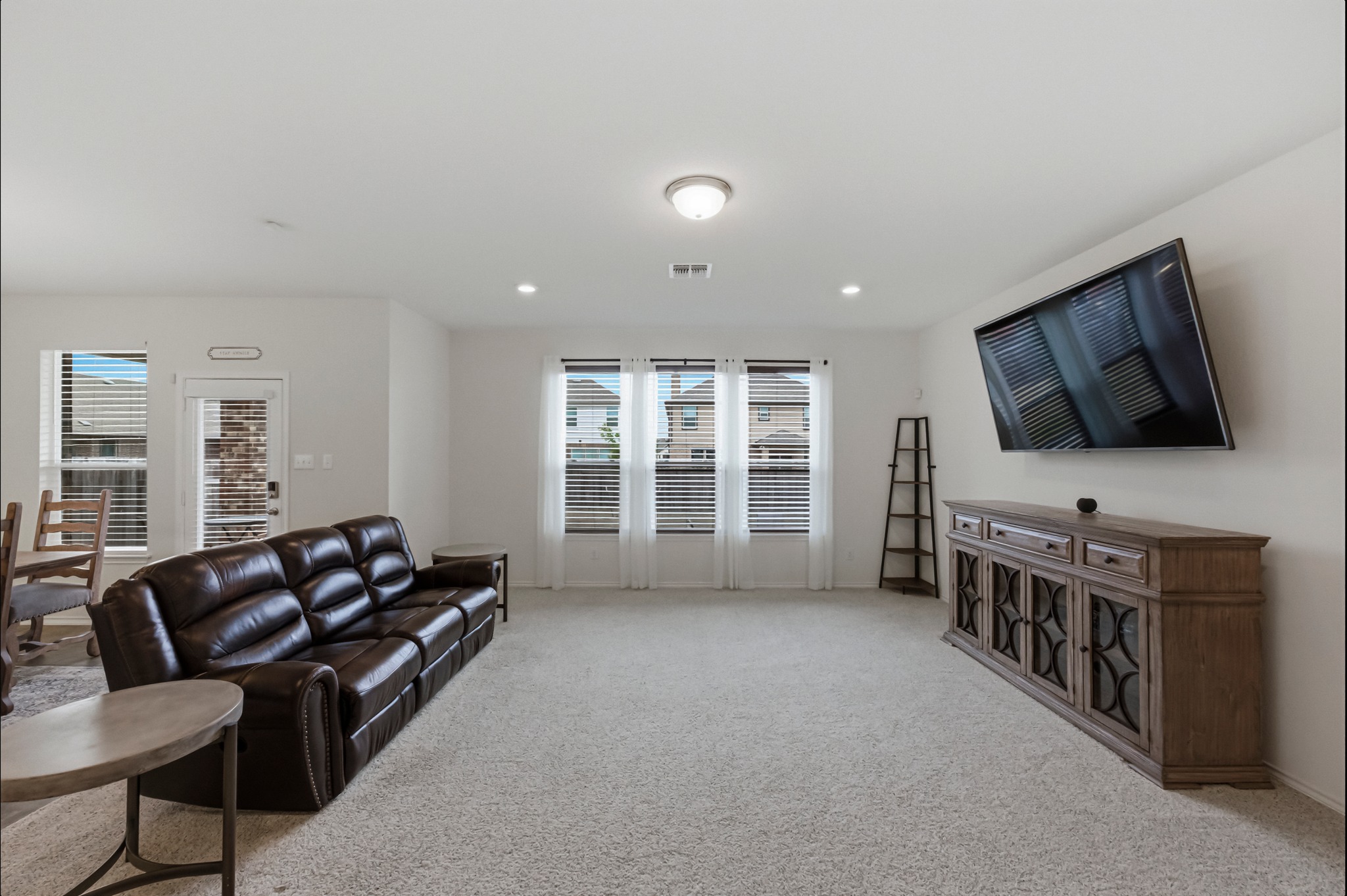 1236 Cornith Lane Leander, TX 78641 - Photo 5 of 32 a living room with furniture and a flat screen tv