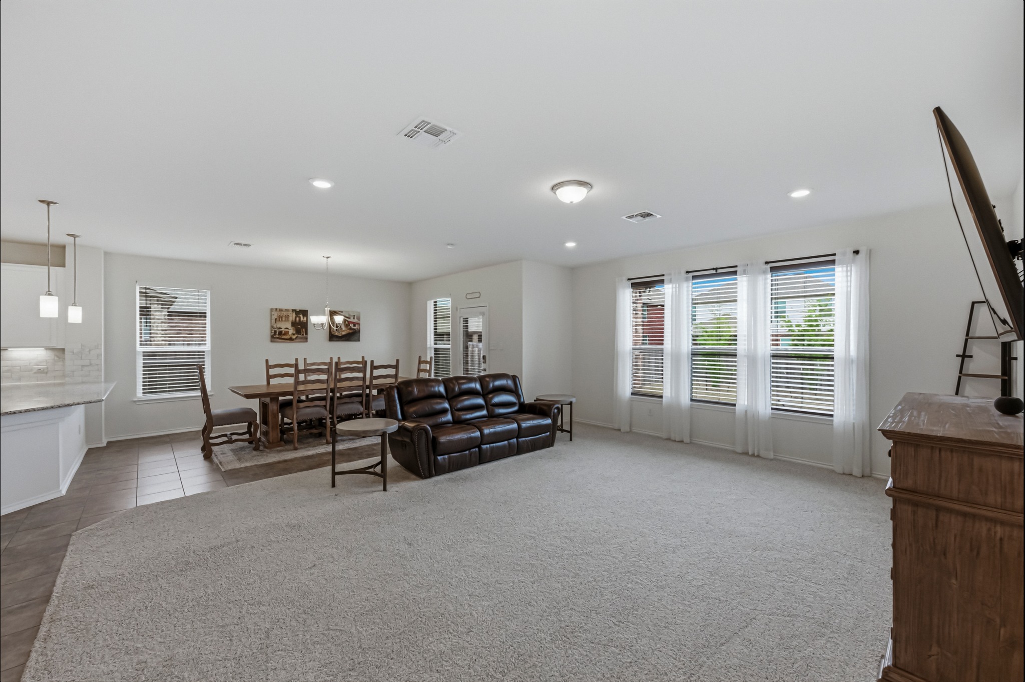 1236 Cornith Lane Leander, TX 78641 - Photo 6 of 32 a living room with furniture and a flat screen tv