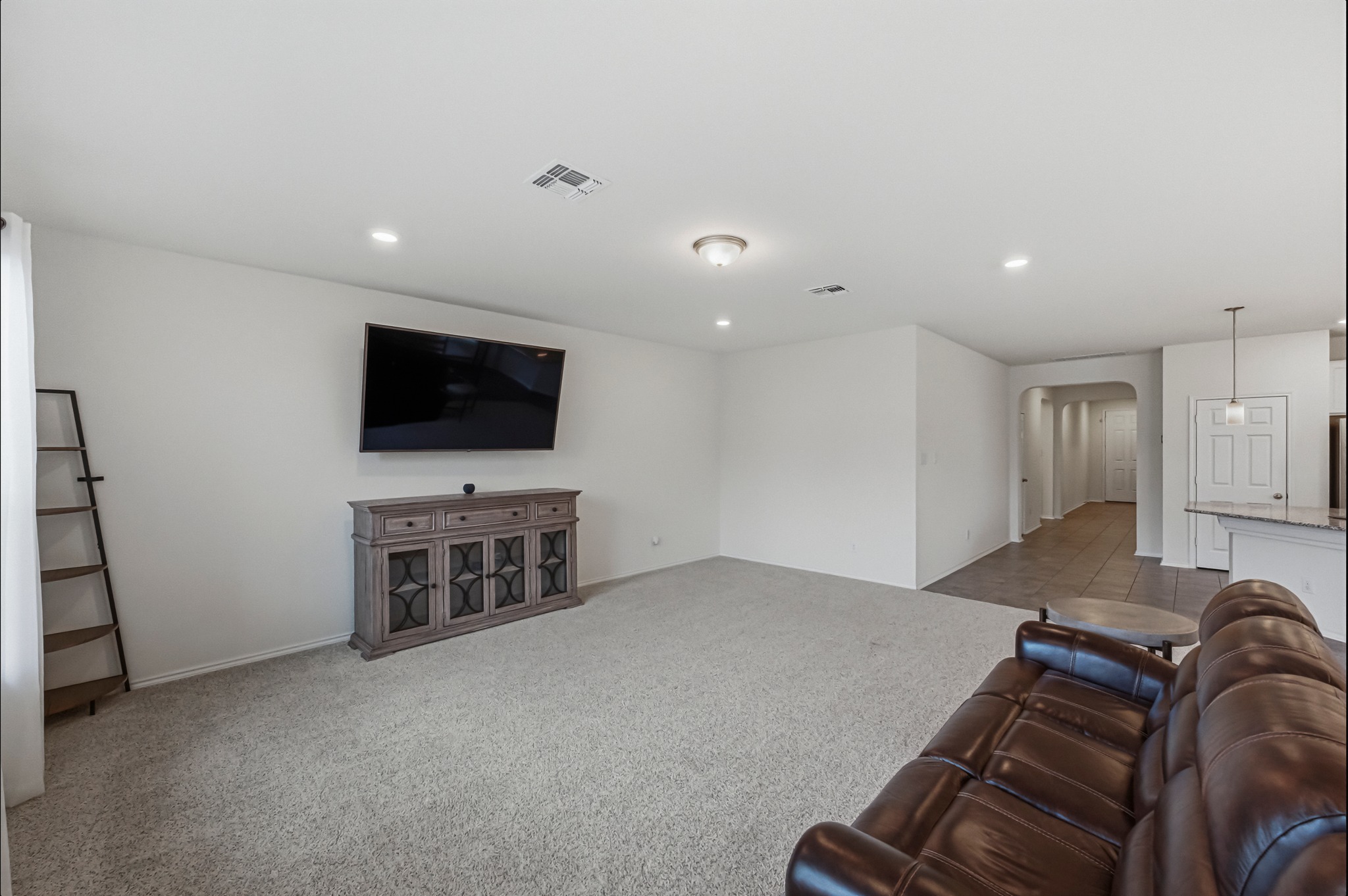 1236 Cornith Lane Leander, TX 78641 - Photo 7 of 32 a living room with furniture and a flat screen tv