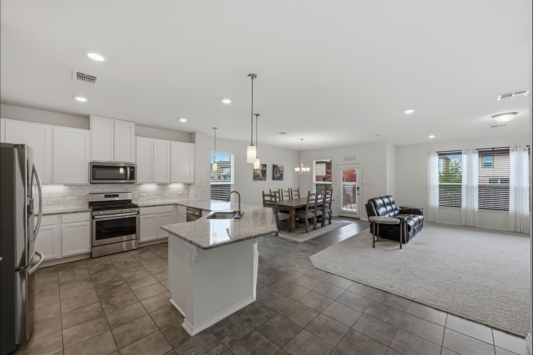 1236 Cornith Lane Leander, TX 78641 - Photo 9 of 32 a large kitchen with cabinets