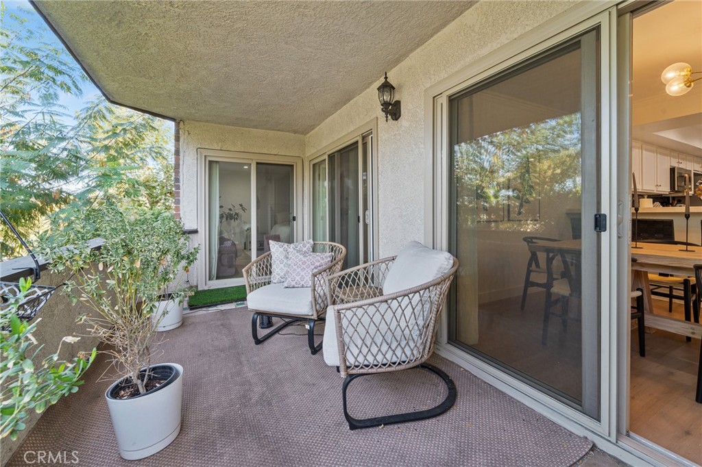 5440 Lindley Avenue, Unit 201 Encino, CA 91316 - Photo 11 of 38 a living room with furniture and a potted plant