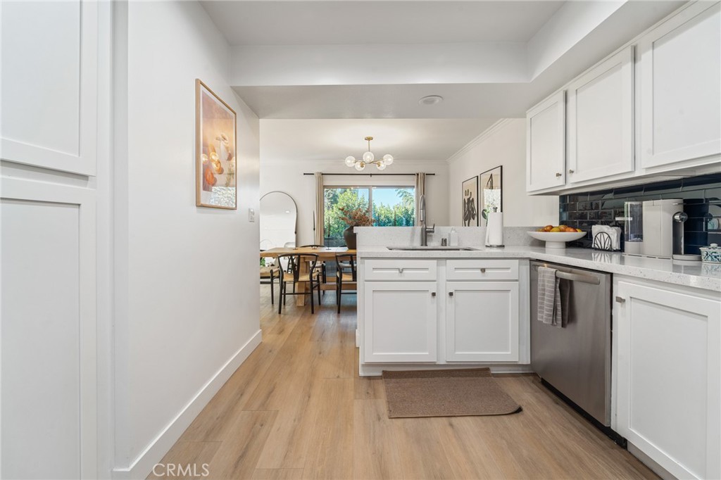 5440 Lindley Avenue, Unit 201 Encino, CA 91316 - Photo 16 of 38 a kitchen with a sink and cabinets