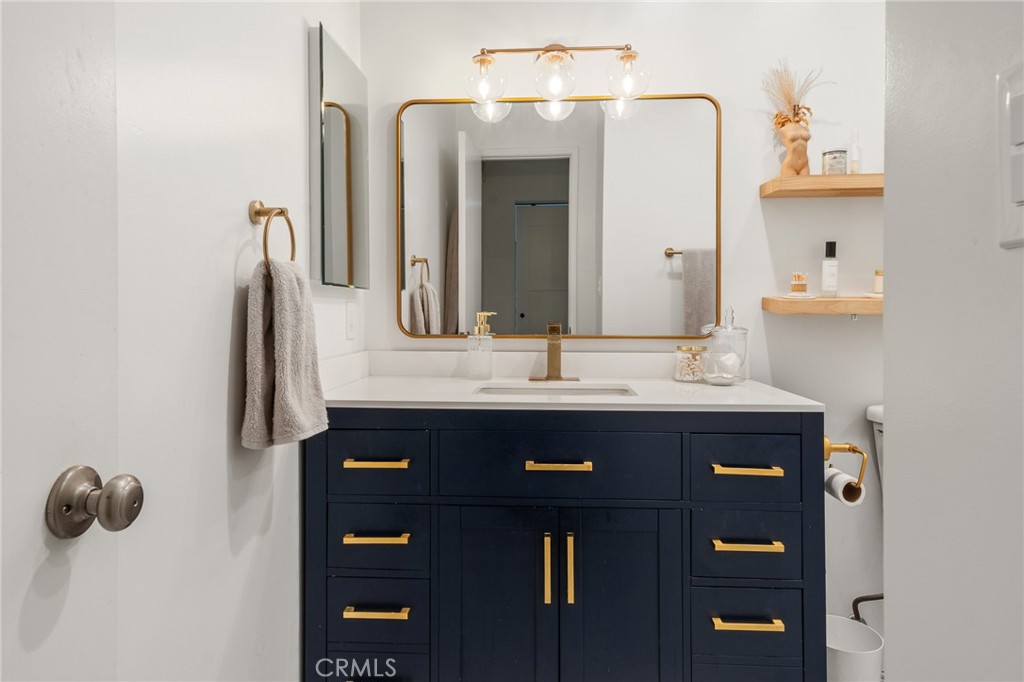 5440 Lindley Avenue, Unit 201 Encino, CA 91316 - Photo 27 of 38 a bathroom with a sink and a mirror