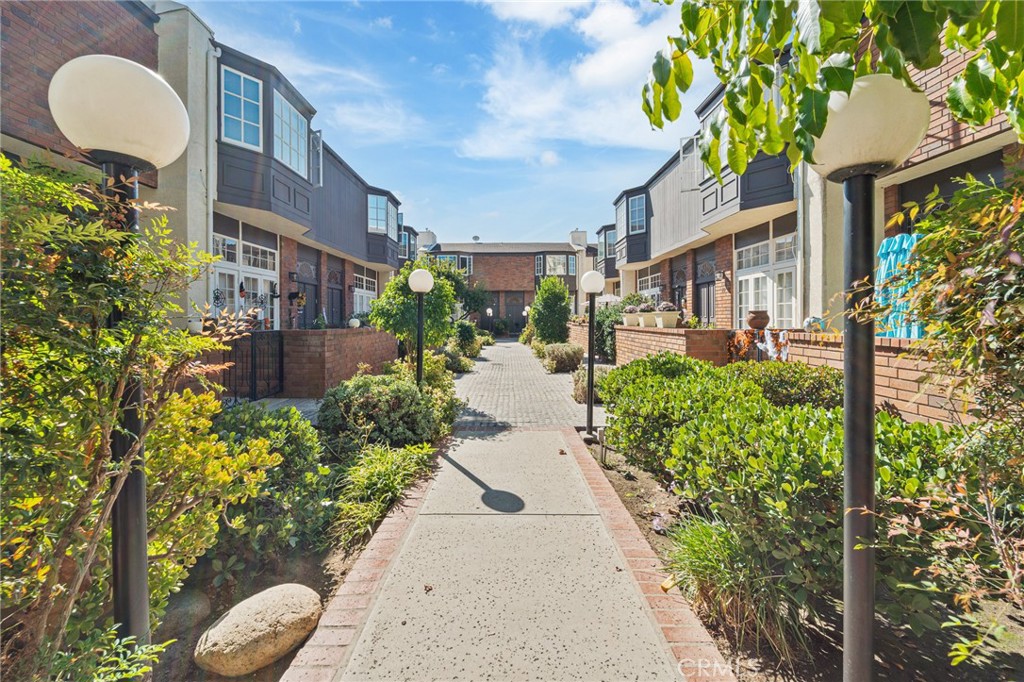 5440 Lindley Avenue, Unit 201 Encino, CA 91316 - Photo 29 of 38 a view of a pathway with a house front of house