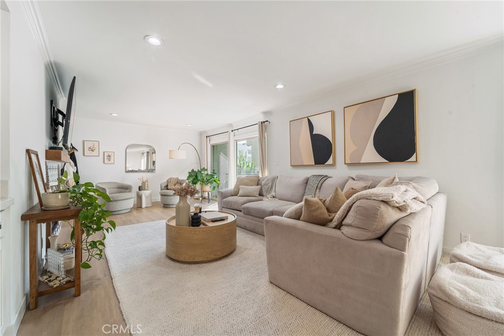 5440 Lindley Avenue, Unit 201 Encino, CA 91316 - Photo 4 of 38 a living room with furniture and flowers