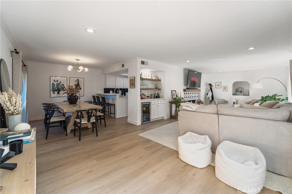 5440 Lindley Avenue, Unit 201 Encino, CA 91316 - Photo 7 of 38 a living room with furniture and a kitchen view