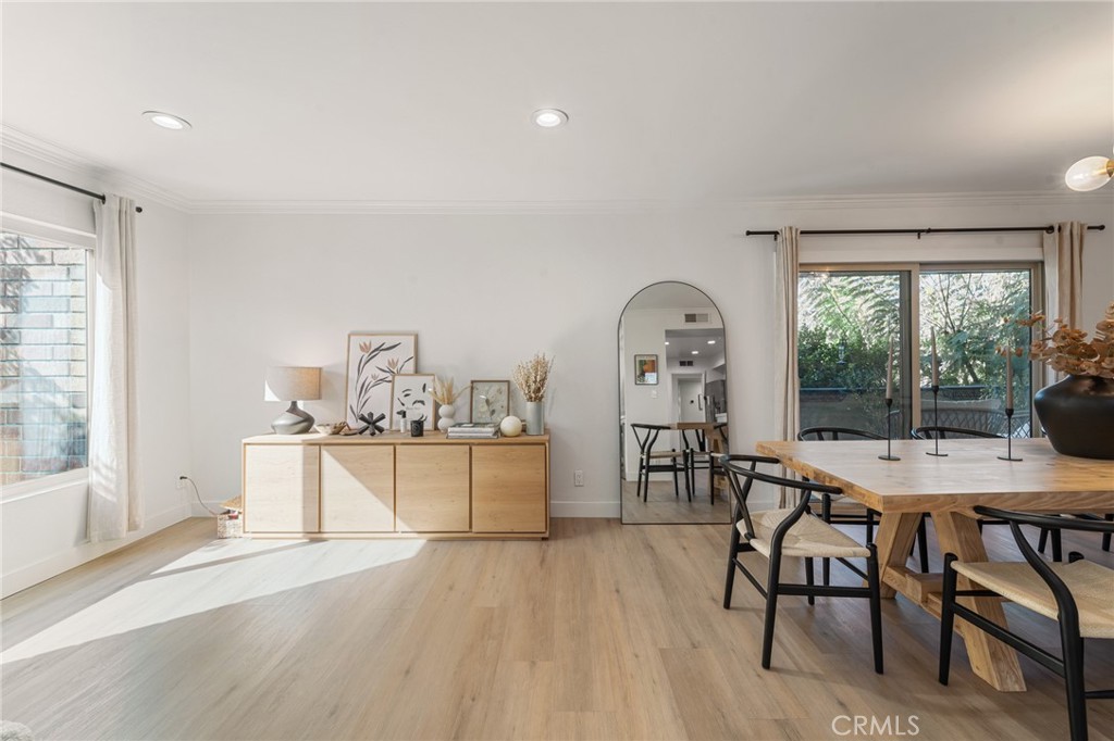 5440 Lindley Avenue, Unit 201 Encino, CA 91316 - Photo 9 of 38 a view of a dining room with furniture window and outside view