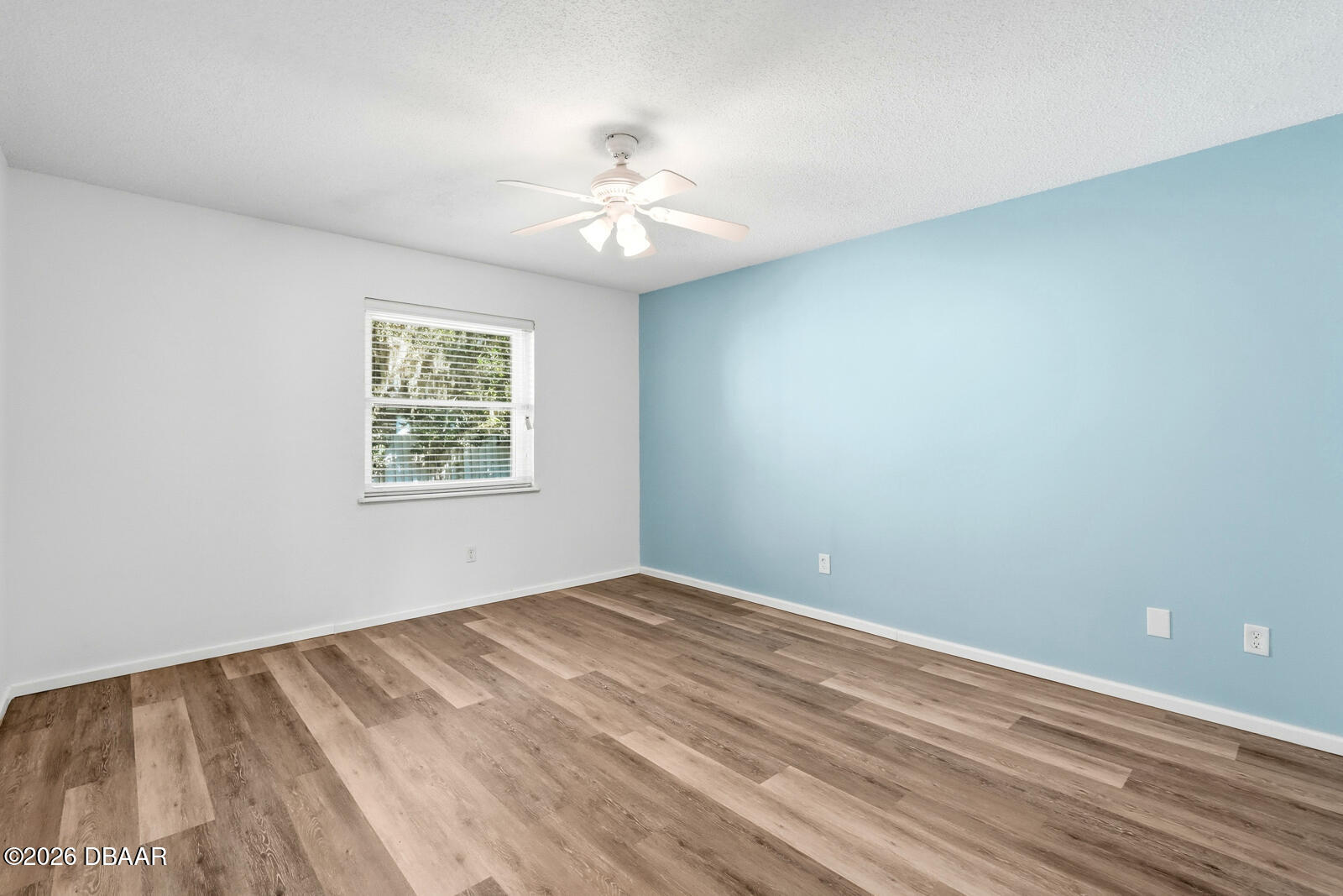 550 Locust Street Port Orange, FL 32127 - Photo 15 of 37 wooden floor in an empty room with a window