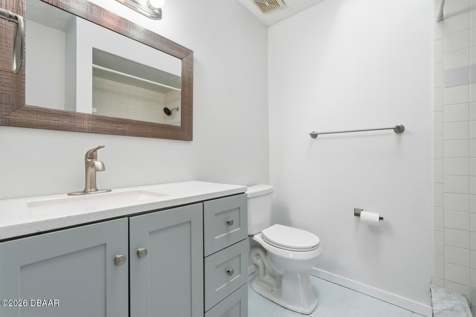 550 Locust Street Port Orange, FL 32127 - Photo 18 of 37 a bathroom with a toilet a sink and mirror