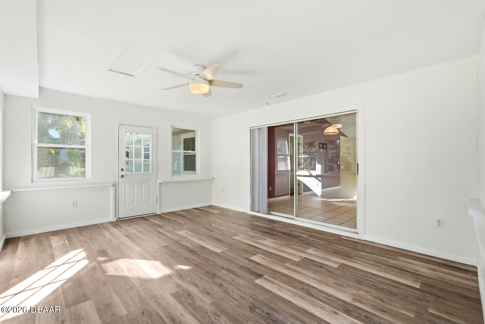 550 Locust Street Port Orange, FL 32127 - Photo 24 of 37 a view of empty room with wooden floor and fan